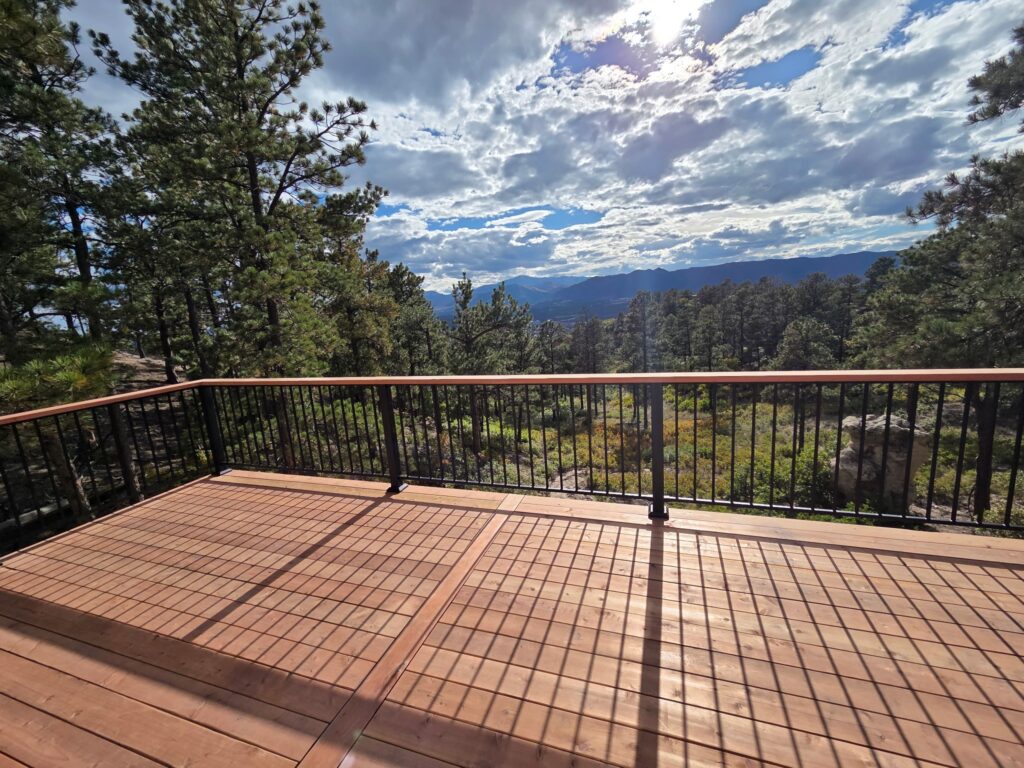 Exterior wood deck stairs and railings at a mountain home